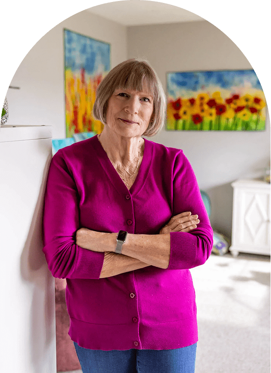 Person in colorful room, leaning on wall