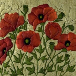 Red poppies with green leaves in an embroidered design.
